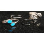 A collection of 4 vintage and contemporary silver bangles  to include turquoise set,