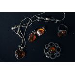 A collection of white metal and silver amber jewellery (set) to include; ring, 2x brooches,
