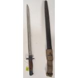 A British military 1907 pattern issue bayonet complete with leather and canvas scabbard.