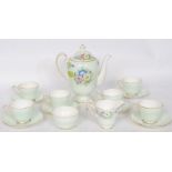 A 1930's Art Deco Royal Crown Pottery ' Perunia ' pattern part tea service to include teapot, cups,