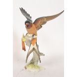 A good continental Hutschenreuther porcelain figurine of a bird, with makers marks to base.