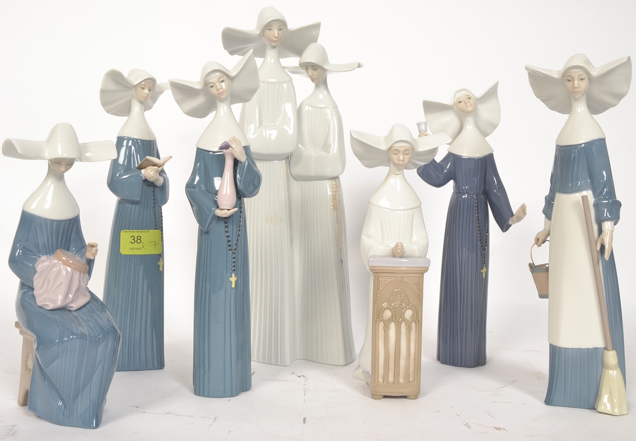 LLADRO; A collection of 7x Lladro china Nun figurines.