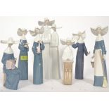 LLADRO; A collection of 7x Lladro china Nun figurines.