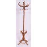 A light bentwood 20th century hat stand having shaped base with hooks atop H190 W69 cm