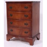 A Georgian style mahogany bachelors chest of drawers raised on bracket feet with short and deep
