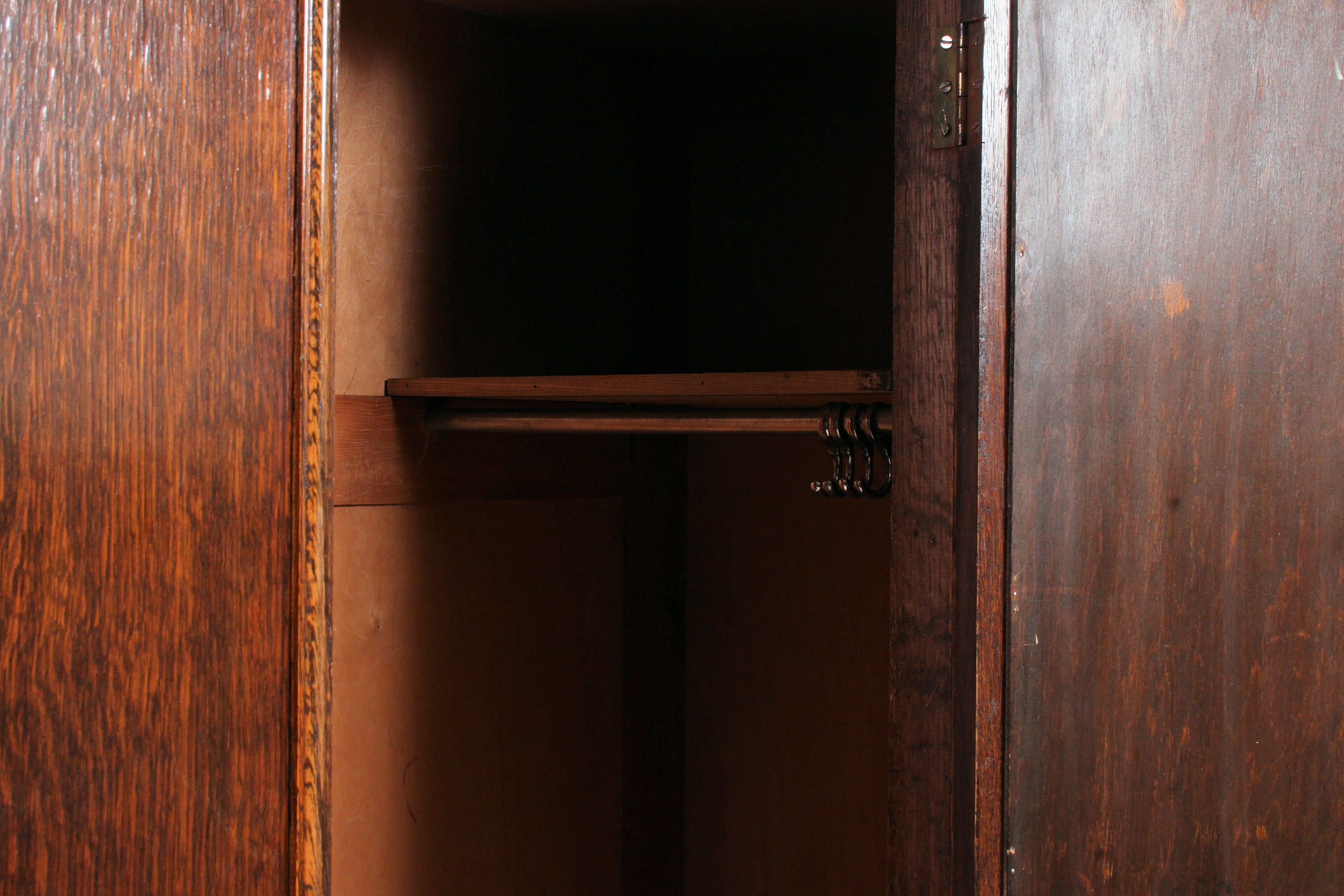 A 1930's Art Deco oak single wardrobe having shaped top with central mirror door having hanging - Image 3 of 3