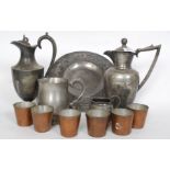 A collection of pewter and Britannia metal items to include jugs, beakers,