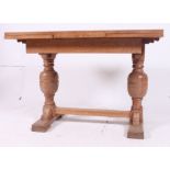 A 1930's oak draw leaf refectory dining table.