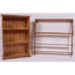 A good sized antique style country pine wall rack with multiple shelves and shaped supports