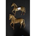 An unusual near pair of 19th century hollow cast bronze horses.