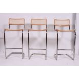 A set of 3 1980's retro caned cantilever Italian bar stools.