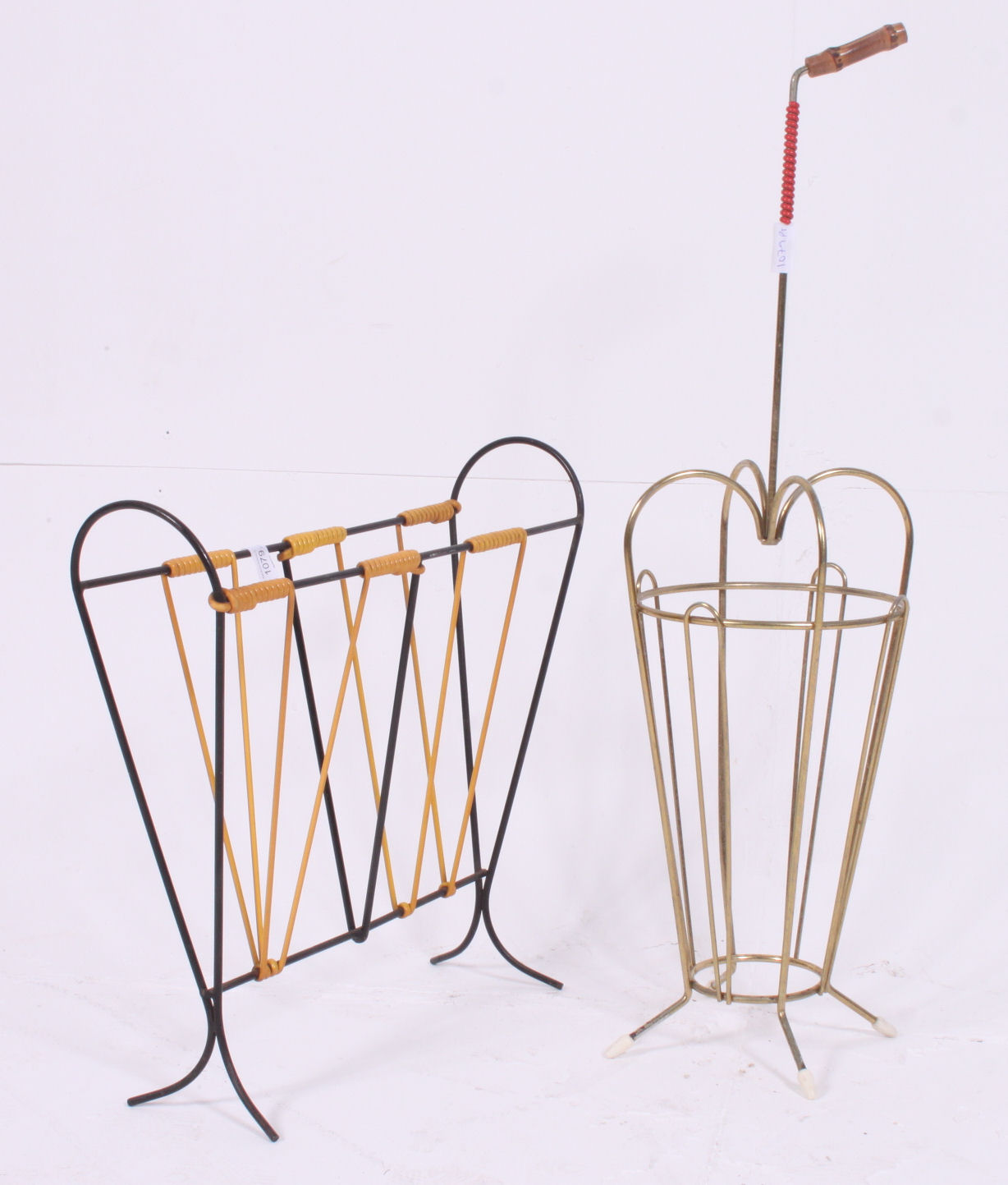 A retro 1950's wire work two tone black and yellow magazine rack together with a metal wire work
