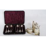 A cased set of teaspoons with faux bamboo spoons along with a ceramic condiment set on silver plate