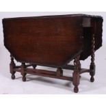 A good quality Jacobean revival barley twist large drop leaf dining table having gadrooned edge