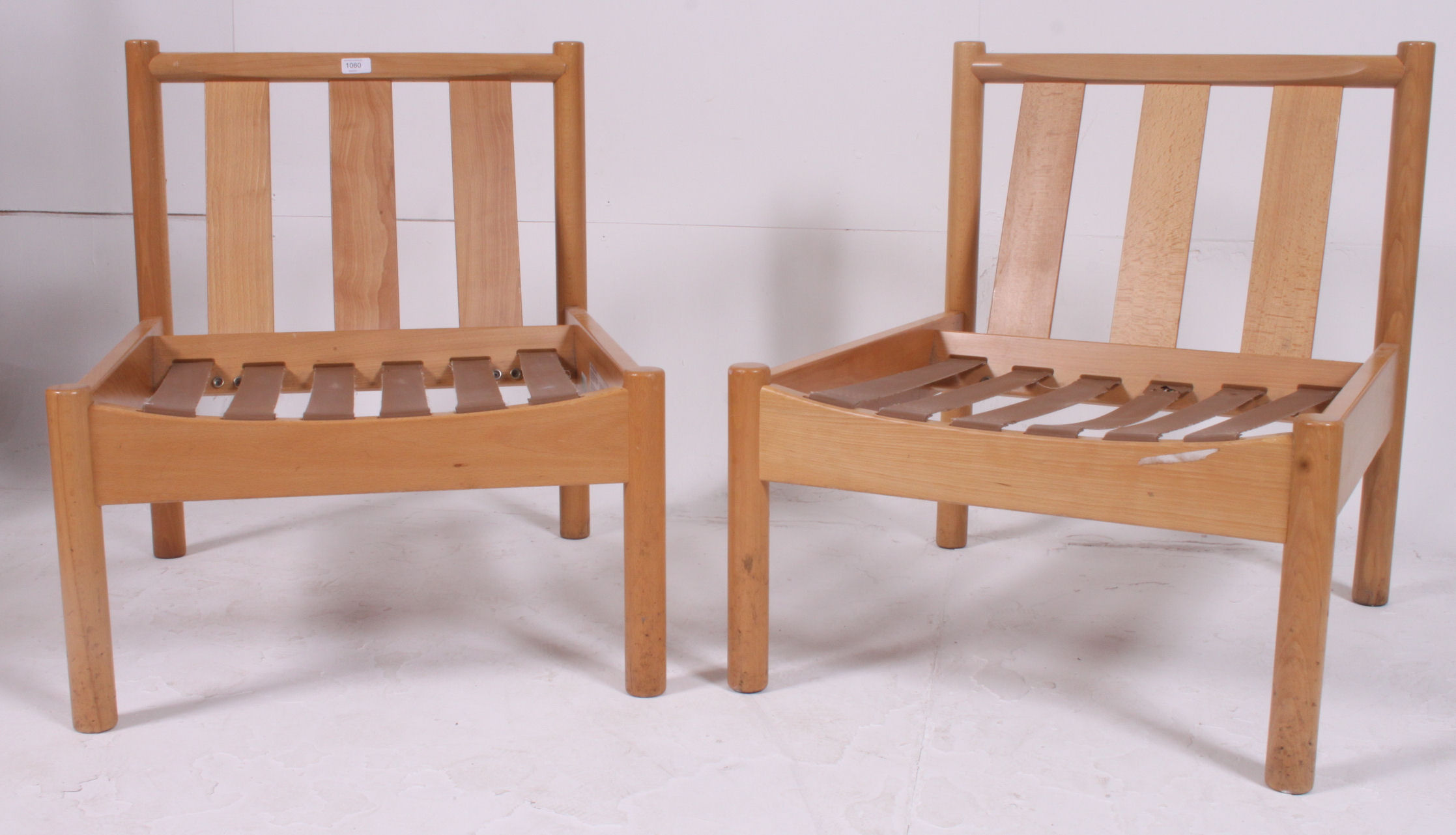A pair of retro school / Industrial Ercol staff chairs ( lacking cushions ) bearing model no 747.
