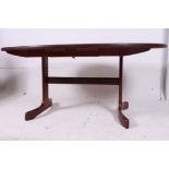 A good G-Plan teak wood teak 1970's retro dining table having splayed legs to centre with oval top