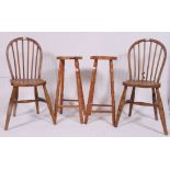 A pair of 20th century pine bar stools raised on turned supports together with 2 country Windsor
