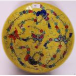 A Chinese famille juane large bowl having yellow ground with butterflies and floral swags.