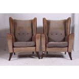A pair of 1950's vintage retro wing back armchairs.