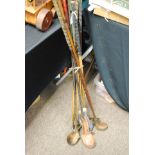 A collection of vintage hickory shaft golf clubs together with others