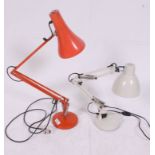 A vintage Herbert Terry anglepoise industrial desk lamp in orange Raised on circular base with