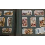 An excellent vintage cigarette card album consisting of many subject / series.
