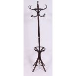 A vintage style 20th century bentwood hat stand in faux bamboo style with hooks atop and shaped