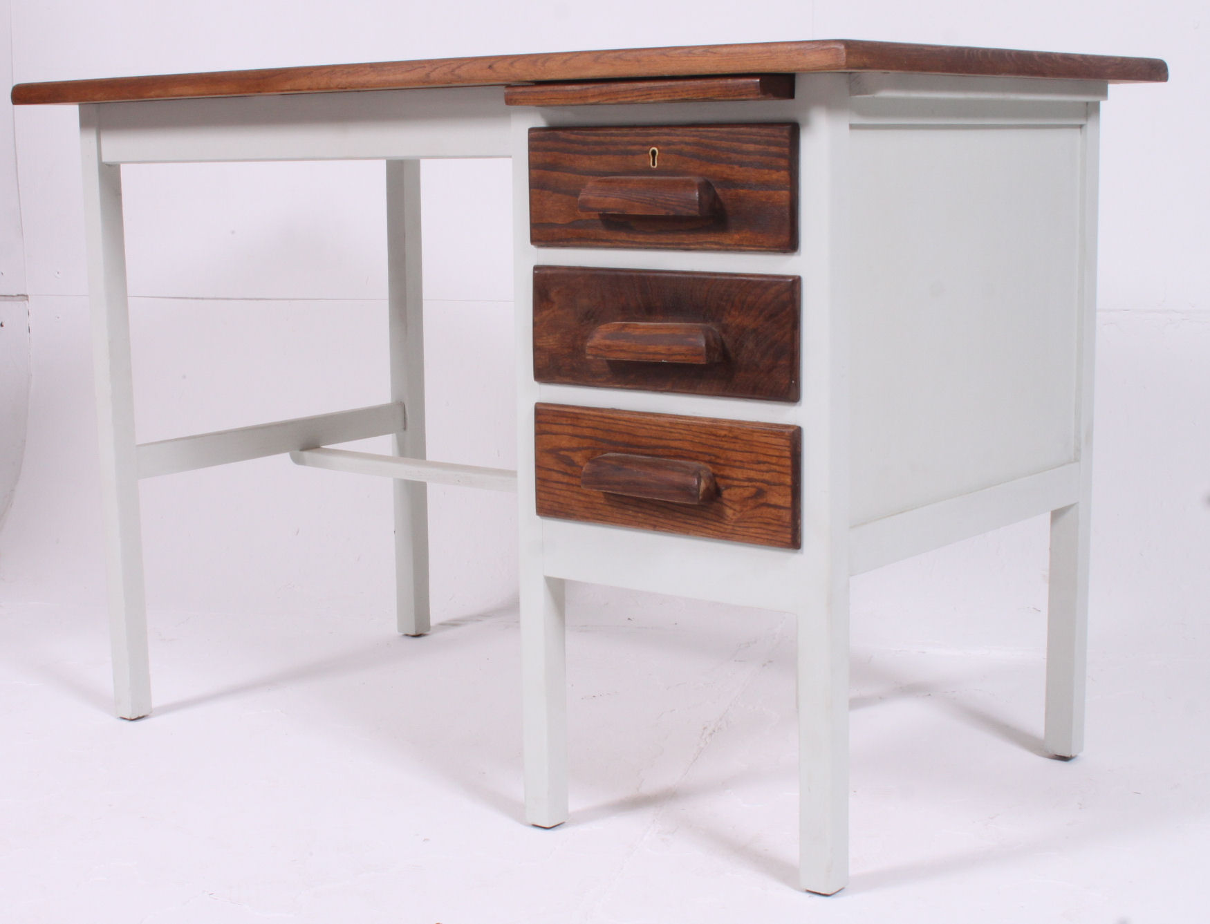 A good shabby chic upcycled painted oak clerks  desk having bank of drawers with open kneehole