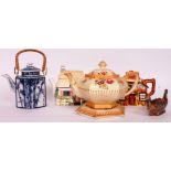 A collection of four tea pots to include Johnson Ltd Burslem with its stand,