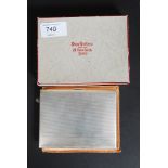 A stunning silver hallmarked cigarette case complete in the original packaging and fabric sleeve