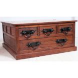 A 20th century contemporary Pandora's box coffee table having hinged top and drawers to the sides