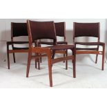 A set of 4 1970's retro vintage teak dining chairs having tapered supports with pad seats in the