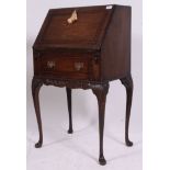 A good quality mahogany ladies writing bureau being raised on cabriole legs with pad feet.