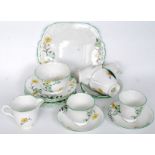 A 1930's Art Deco Melba handpainted bone china part tea service comprising cups, saucers, plates,