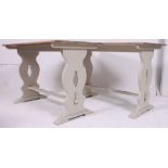 A pair of 20th century golden oak and shabby chic painted dining tables - pub tables.