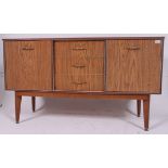 A 1950's retro faux teak wood dresser sideboard with cupboards and central bank of drawers
H78 W137