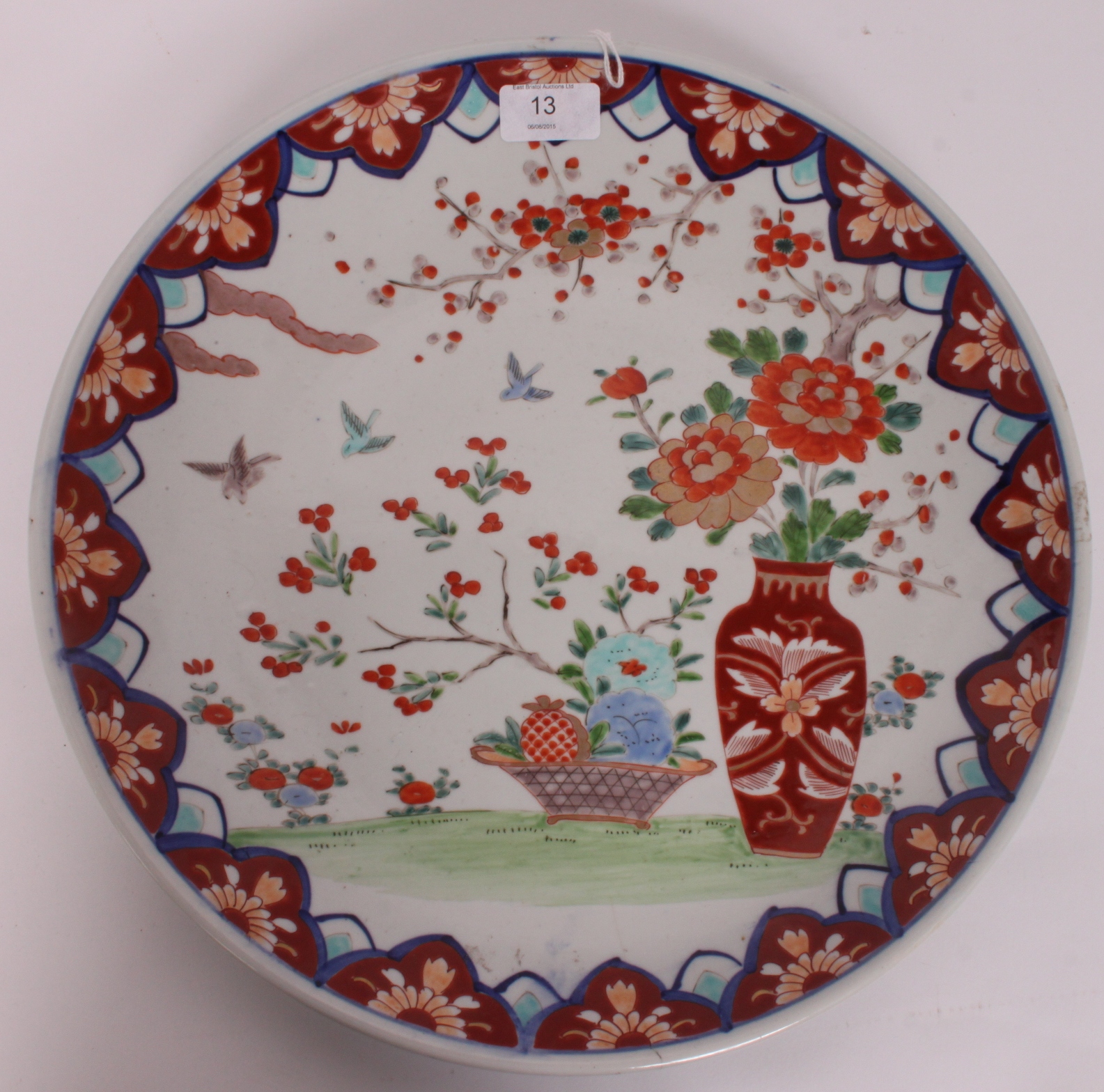 A 19th century Chinese large Imari porcelain wall charger plate having central chrysanthemum in