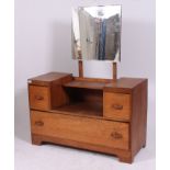 A 1930's Art Deco oak drop centre dressing table chest.