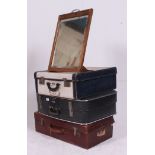 A stack of vintage suitcases to include leather example,