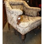An Edwardian shabby chic mahogany salon armchair.