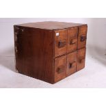 A vintage 20th century Industrial office desk top filing cabinet / stationary cupboard having