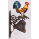 A large cast iron exterior wall hanging bell, on bracket,