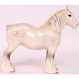 A Beswick ceramic figurine of a Shire Horse having white  / yellow braid H23cm