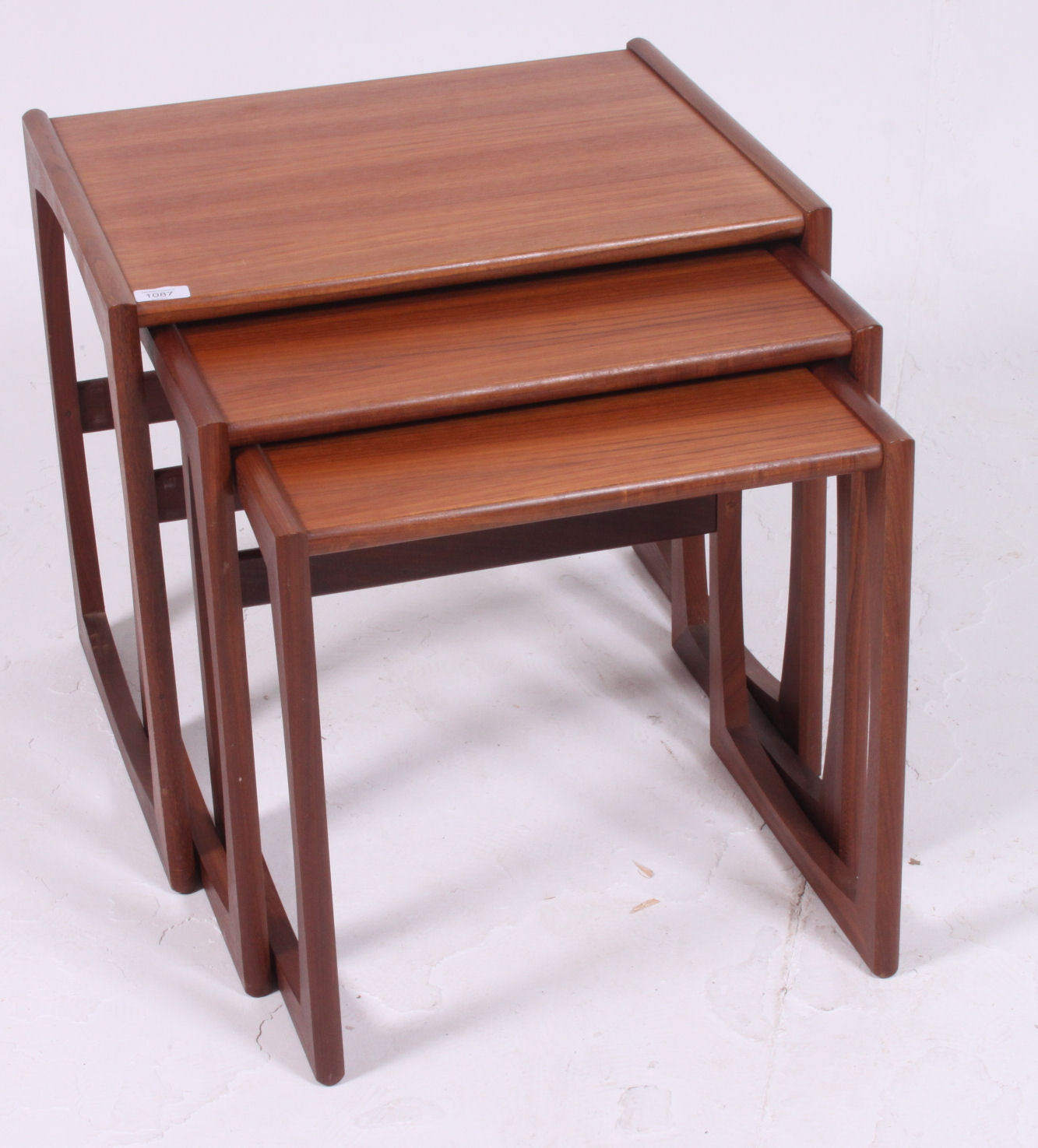 A 1970's G-Plan Kelso pattern retro teak wood nest of tables raised on shaped supports with - Image 2 of 3