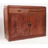 A 1930's Art Deco oak sideboard. Of shaped form sat on plinth base with cupboards and short drawers.