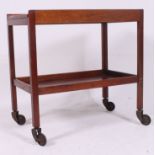 A 1960's Gordon Russell mahogany twin tier buffet / butlers trolley having sprung original castors