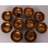 A collection of Chinese wooden laquered rice bowls stylised individually with butterflies, goldfish,