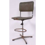 A vintage 1940's metal Industrial machinists chair with the original upholstered green rexxine seat