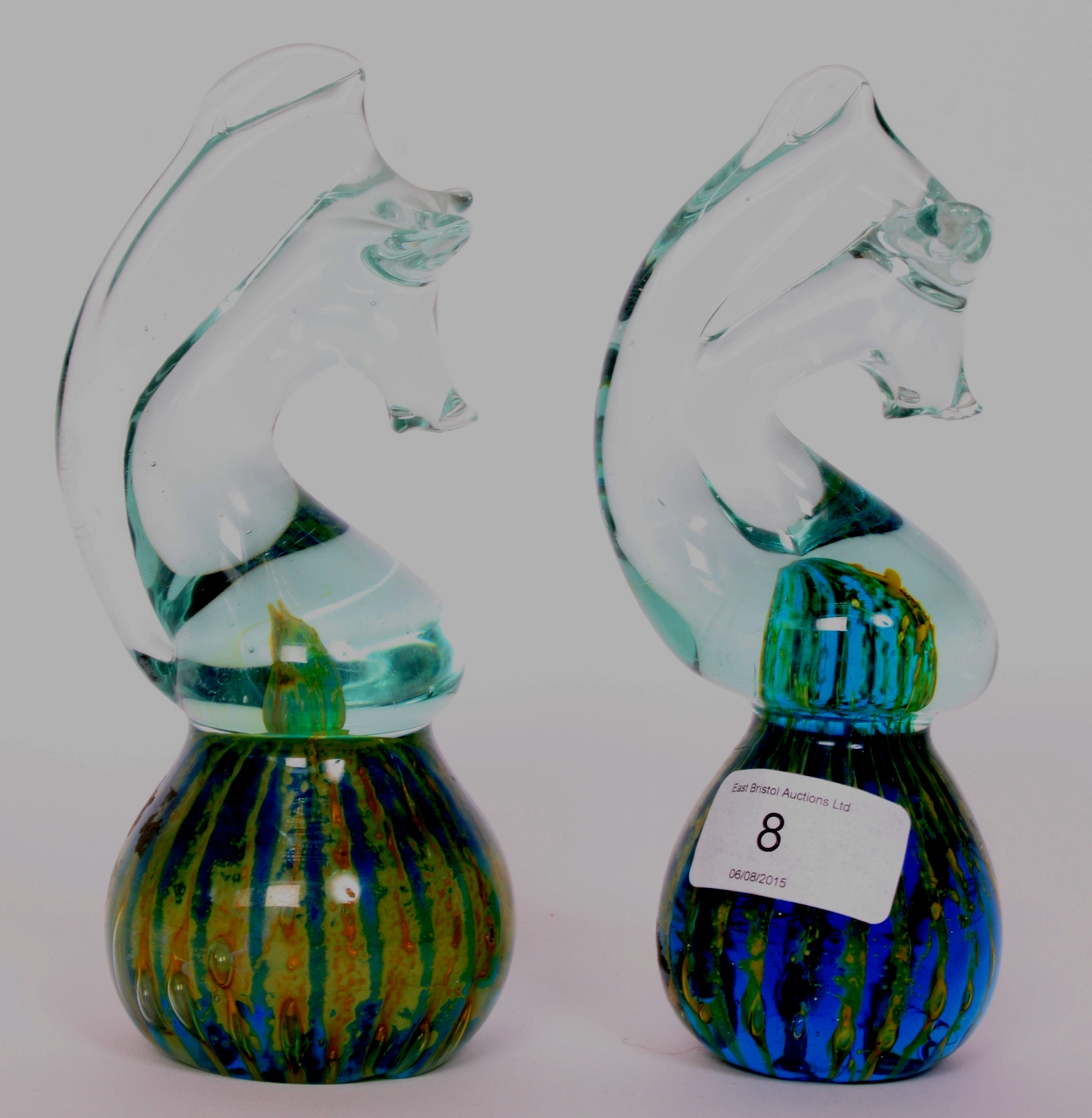 A pair of MDina studio glass paperweights in the form of sea horses,