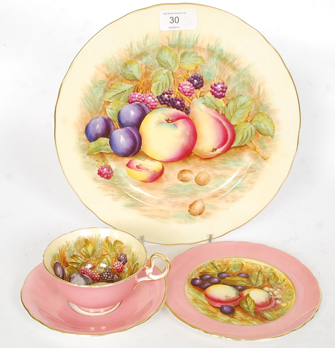 A collection of Aynsley fruit still life design china to include a trio along with a trio.